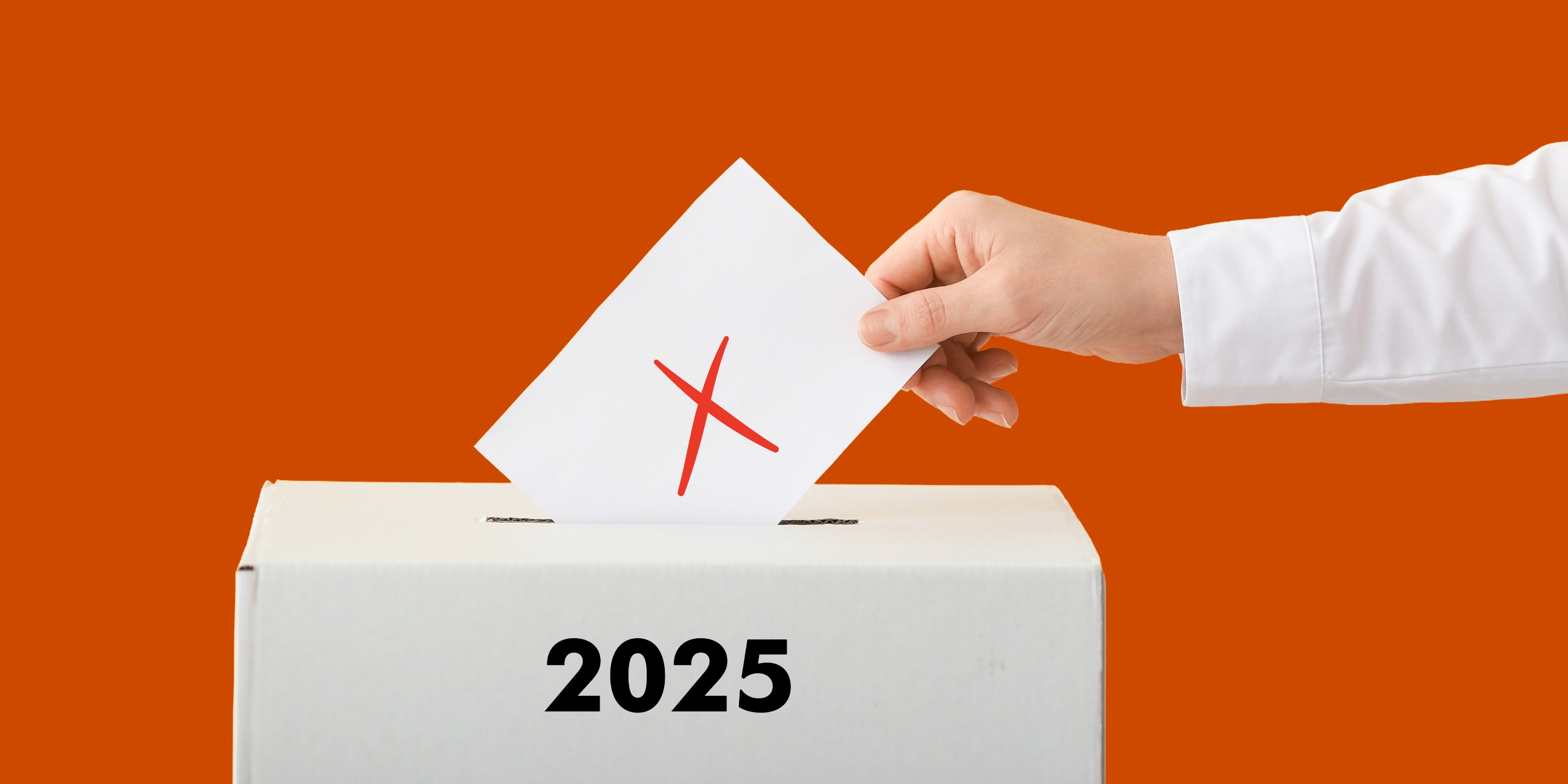 Et papir med et kryds på, der lægges ned i en kasse 